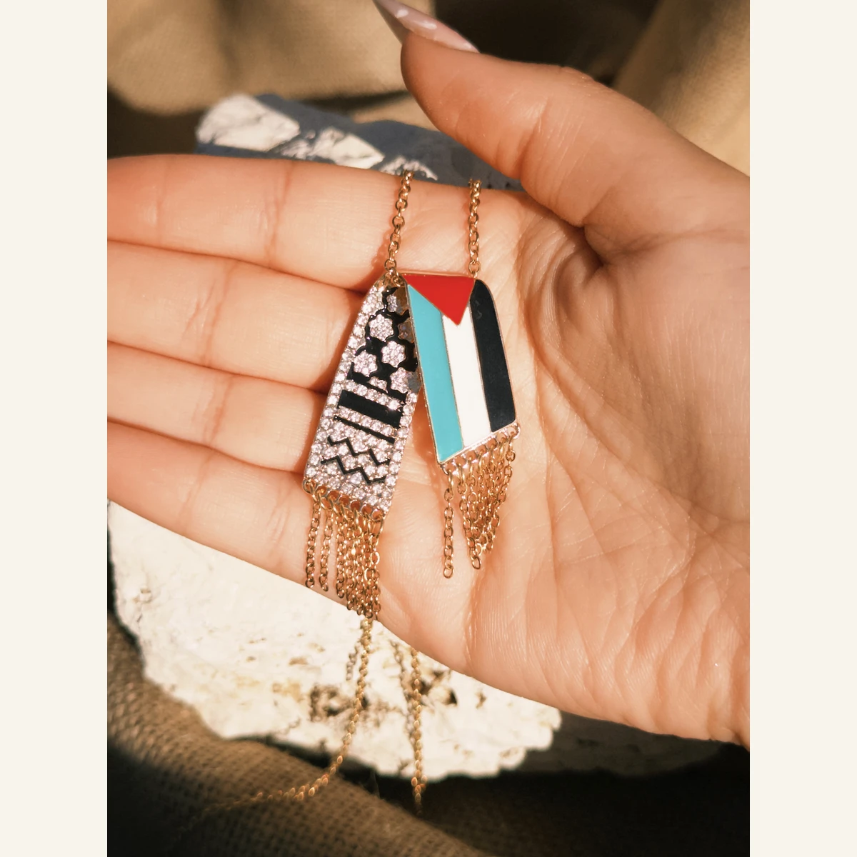 Palestinian Flag Keffiyeh Necklace held in hand to show its size