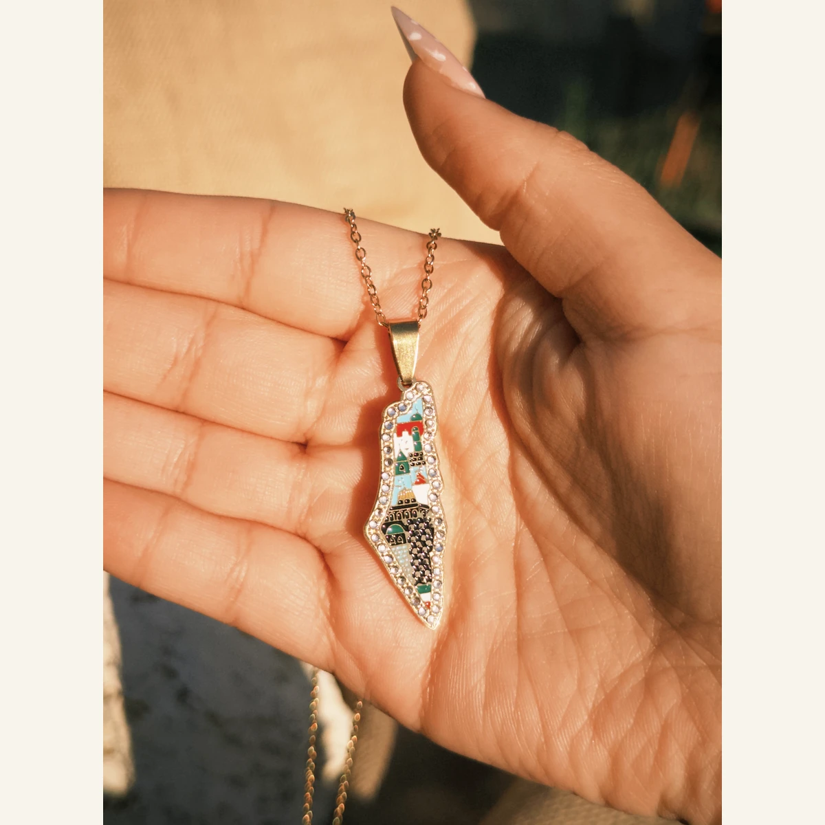 Multicolor Palestine Mosaic Necklace held in hand to show its size